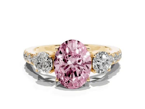 Fancy Pink Oval Cut Cut Diamond Three-Stone Ring with Round Side Stones and Pavé Band Yellow gold