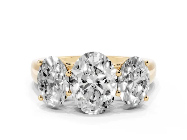 Oval Cut Three-Stone Diamond Ring with Prong Setting on a Classic Band Yellow gold