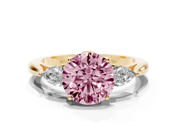 Fancy Pink Three-Stone Round Cut Diamond Ring with Pear Side Stones in Four-Prong Setting Yellow gold