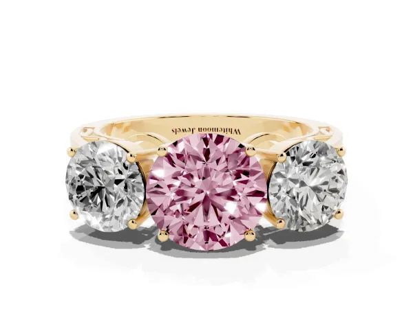 Fancy Pink Round Cut Diamond Three-Stone Ring with Prong Setting and Textured Band Yellow gold