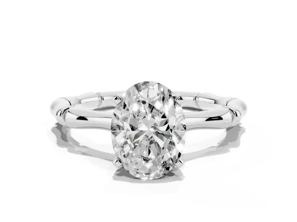 Oval Cut Solitaire Diamond Ring with Bamboo Band and Four-Prong Setting White gold