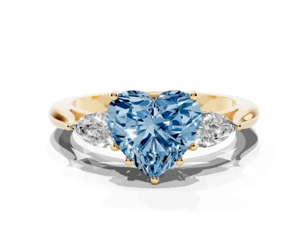 Fancy Blue Heart Cut Diamond Three-Stone Ring with Pear Side Stones and Prong Setting Yellow gold