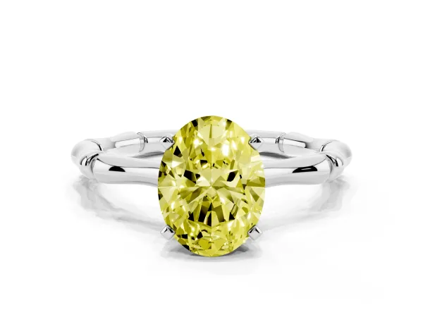 Fancy Yellow Oval Cut Solitaire Diamond Ring with Bamboo Band and Four-Prong Setting Platinum