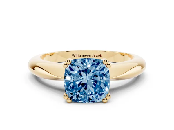 Fancy Blue Cushion Cut Cut Solitaire Engagement Ring with Tapered Band and Four-Prong Setting Yellow gold