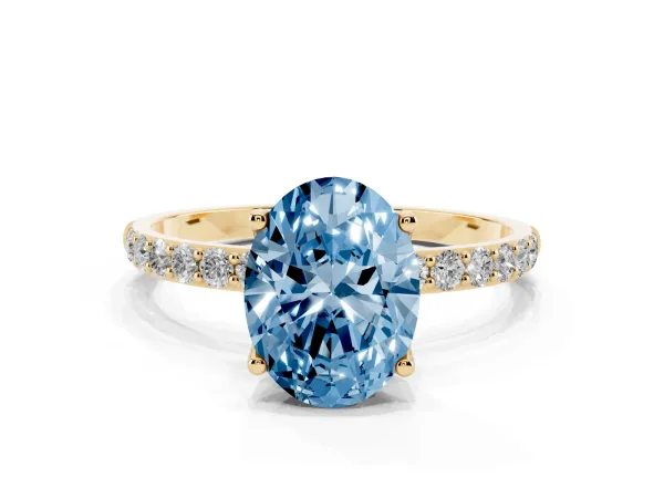 Fancy Blue Oval Cut Diamond Solitaire Engagement Ring with Round Pavé Band and Prong Setting Yellow gold