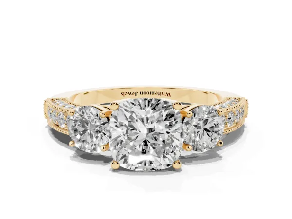 Cushion Cut Three-Stone Diamond Ring with Pavé Band and Four-Prong Setting Yellow gold