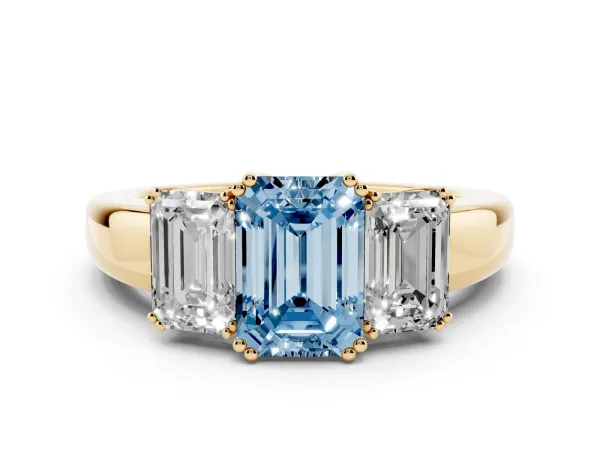 Fancy Blue Three-Stone Emerald Cut Cut Diamond Ring with Channel Set Band and Four-Prong Setting Yellow gold