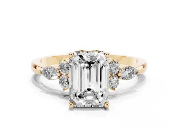 Emerald Cut Brilliant Diamond Solitaire Ring with Pear Side Stones and Four-Prong Setting Yellow gold
