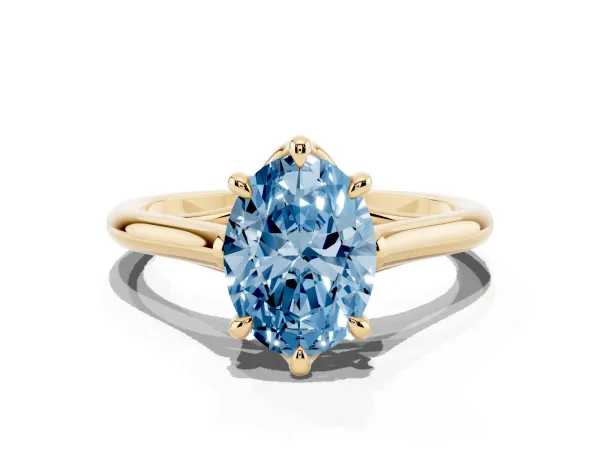 Fancy Blue Oval Cut Solitaire Engagement Ring with Six-Prong Setting and Classic Band Yellow gold