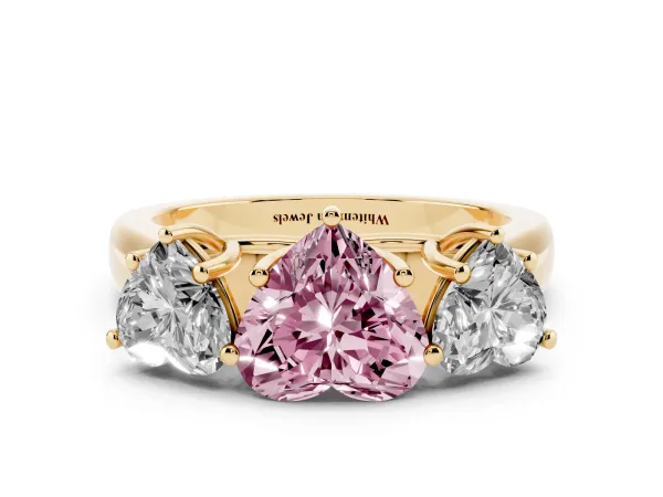 Fancy Pink Heart Cut Three-Stone Diamond Ring with Prong Setting on a Classic Band Yellow gold