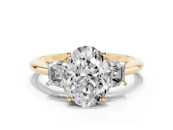 Oval Cut Diamond Three-Stone Ring with Trapezoid Side Stones and Prong Setting Yellow gold