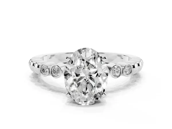Oval Cut Solitaire Bezel Accent Diamond Engagement Ring with Beaded Band and Four-Prong Setting White gold