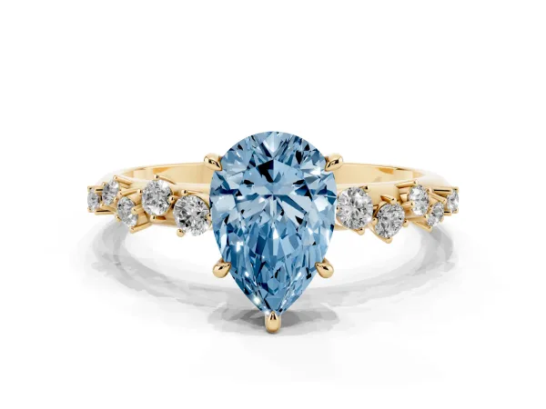 Fancy Blue Pear Cut Diamond Cluster Side Stone Solitaire Ring with Prong Setting Yellow gold