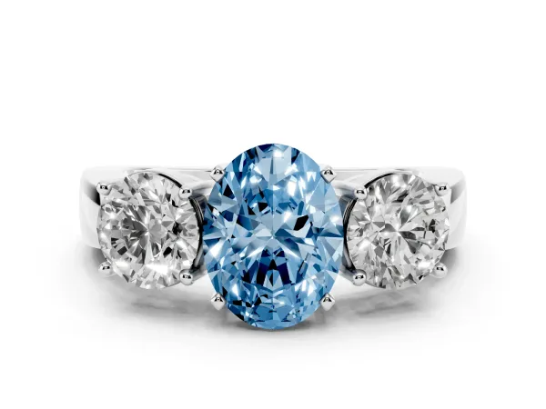 Fancy Blue Three-Stone Oval Cut Diamond Ring with Round Side Stones, Classic Band, and Four-Prong Setting Platinum