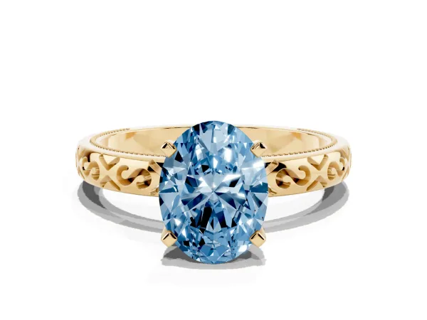 Fancy Blue Oval Cut Solitaire Engagement Ring with Scrollwork Band and Four-Prong Setting Yellow gold