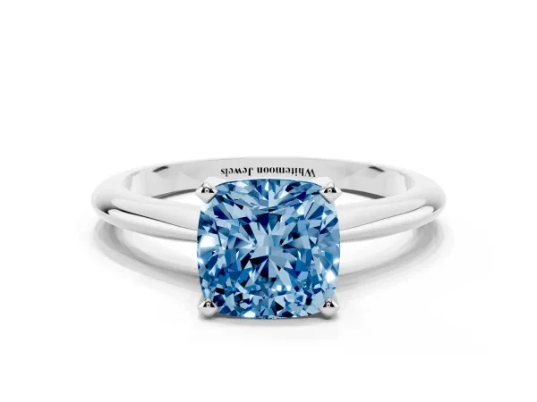 Fancy Blue Cushion Cut Cut Solitaire Ring with Four-Prong Setting on a Classic Band Platinum