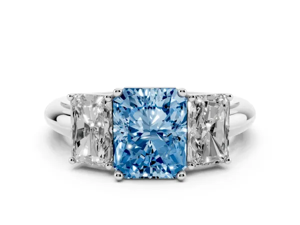 Fancy Blue Three-Stone Radiant Cut Cut Diamond Engagement Ring with Prong Setting on a White Gold Band White gold