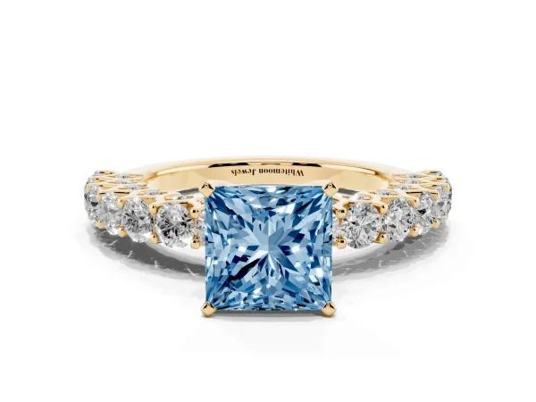 Fancy Blue Princess Cut Diamond Solitaire Ring with Shared Prong Pavé Band and Four-Prong Setting Yellow gold
