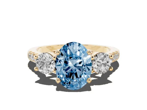 Fancy Blue Three-Stone Oval Cut Diamond Pavé Band with Four-Prong Setting Yellow gold