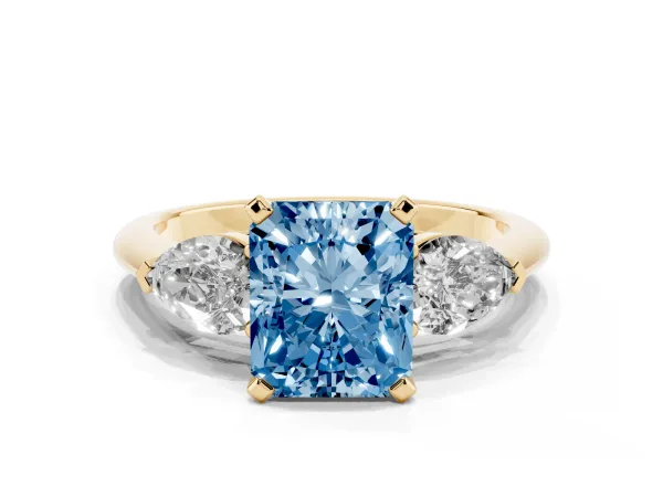 Fancy Blue Three-Stone Radiant Cut Diamond Ring with Pear Side Stones and Four-Prong Setting Yellow gold