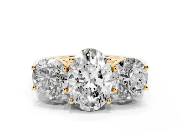 Three-Stone Oval Cut Diamond Engagement Ring with Prong Setting on a Classic Band Yellow gold