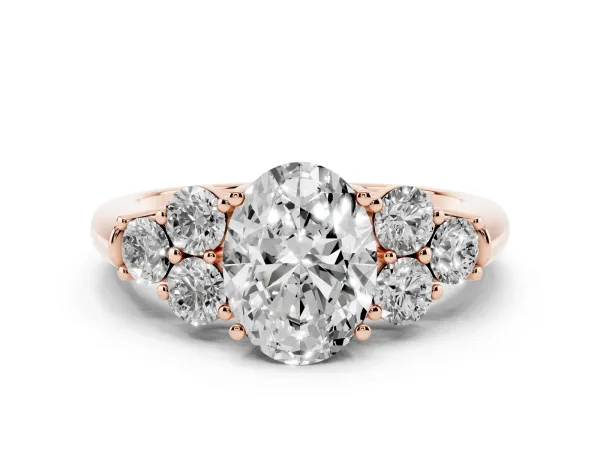 Oval Cut Cut Diamond Cluster Ring with Round Accent Stones and Prong Setting on a Classic Band Rose gold