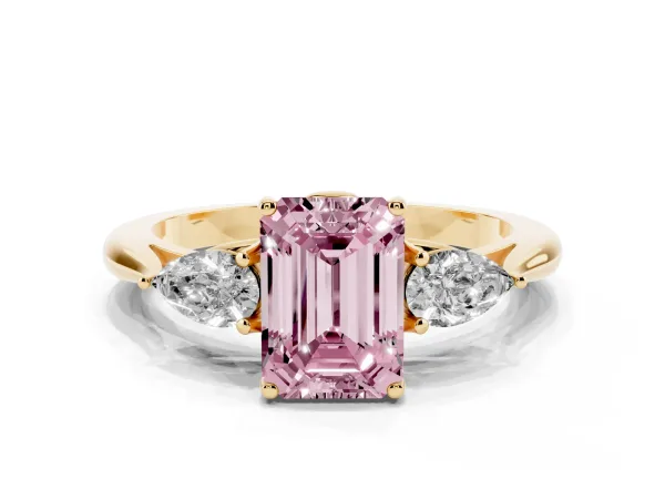 Fancy Pink Three-Stone Emerald Cut Diamond Ring with Pear Side Stones in Four-Prong Setting Yellow gold