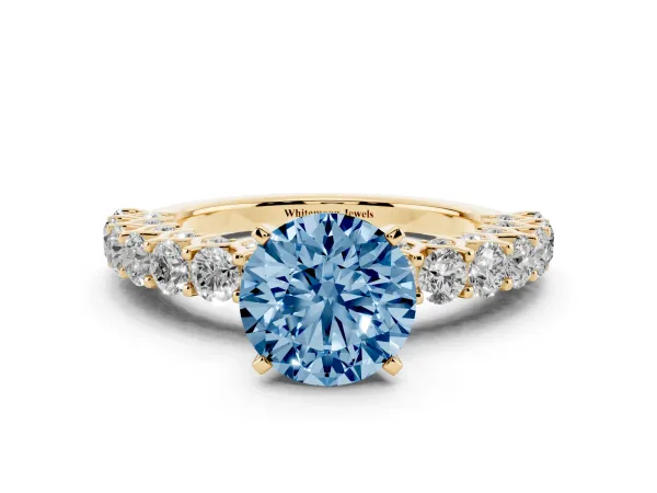 Fancy Blue Round Cut Diamond Solitaire Ring with Shared Prong Pavé Band and Four-Prong Setting Yellow gold