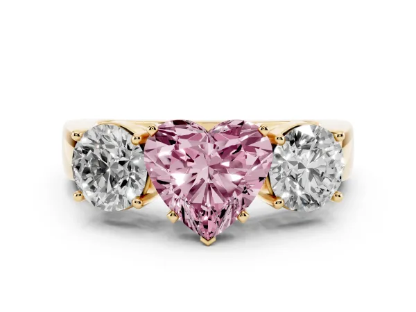 Fancy Pink Three-Stone Heart Cut Diamond Ring with Round Side Stones, Classic Band, and Four-Prong Setting Yellow gold