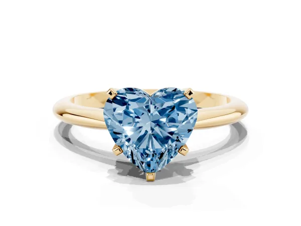 Fancy Blue Heart Cut Cut Solitaire Ring with Four-Prong Setting on a Classic Band Yellow gold