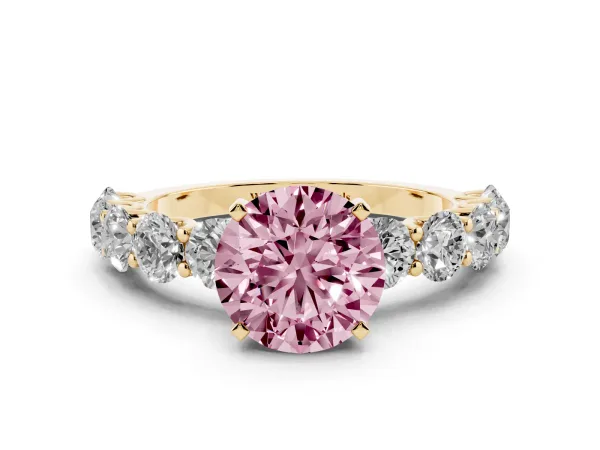 Fancy Pink Round Cut Diamond Prong Setting with Side Stones on a Pave Band Yellow gold