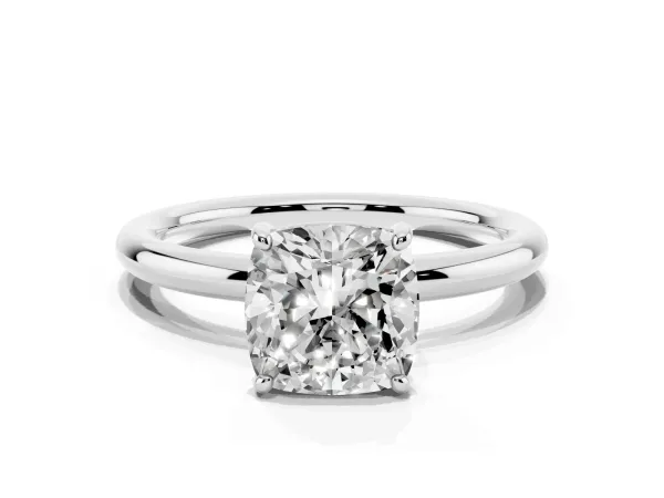 Cushion Cut Solitaire Diamond Ring with Four-Prong Setting on a Plain Band Platinum