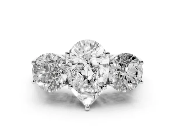 Three-Stone Pear Cut Diamond Engagement Ring with Prong Setting on a Classic Band Platinum