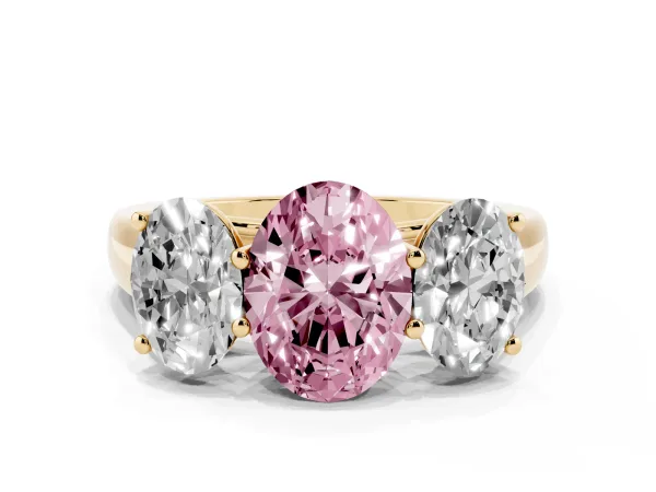 Fancy Pink Oval Cut Three-Stone Diamond Ring with Prong Setting on a Classic Band Yellow gold