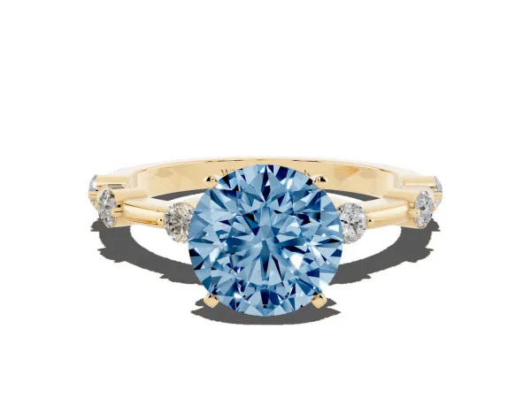 Fancy Blue Round Cut Solitaire Diamond Ring with Bezel Set Side Stones and Prong Setting Yellow gold