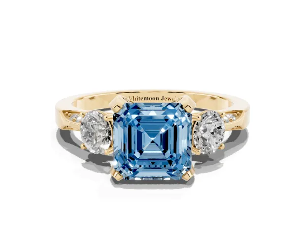 Fancy Blue Asscher Cut Brilliant Three-Stone Diamond Ring with Pavé Band and Four-Prong Setting Yellow gold