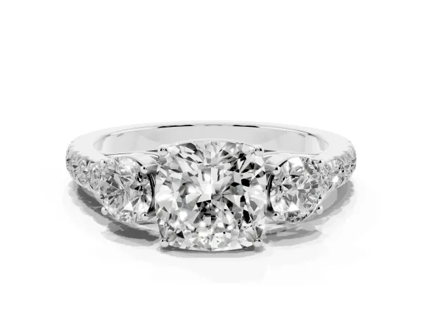 Cushion Cut Cut Diamond Three-Stone Ring with Round Side Stones and Pavé Band Platinum