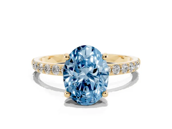 Fancy Blue Oval Cut Diamond Solitaire Ring with Round Pavé Band and Prong Setting Yellow gold
