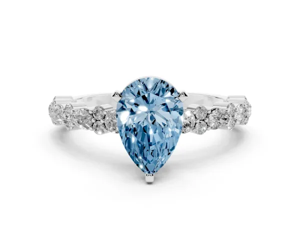 Fancy Blue Pear Cut Diamond Side Stone Solitaire Ring with Round and Four-Prong Setting Platinum