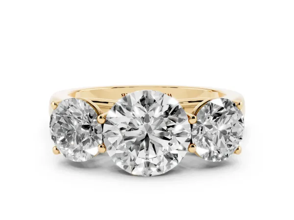 Round Cut Three-Stone Diamond Ring with Prong Setting on a Classic Band Yellow gold