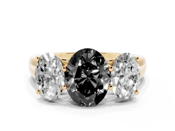 Fancy Black Oval Cut Three-Stone Diamond Ring with Prong Setting on a Classic Band Yellow gold