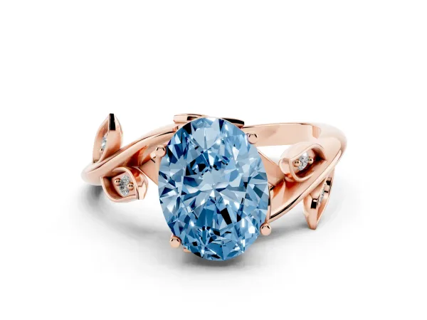 Fancy Blue Oval Cut Solitaire Twist Engagement Ring with Leaf Accents and Prong Setting Rose gold