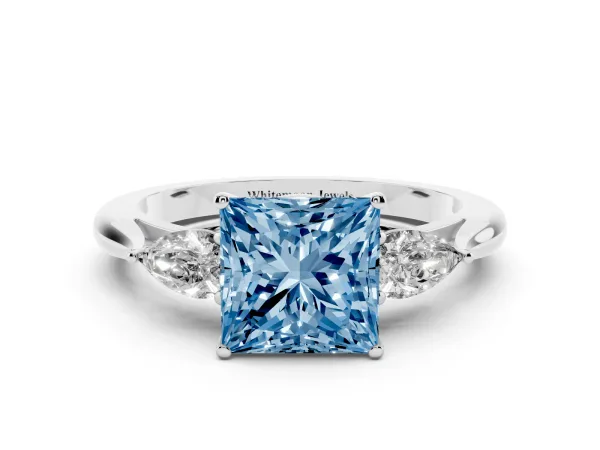 Fancy Blue Three-Stone Princess Cut Diamond Ring with Pear Side Stones in Four-Prong Setting Platinum