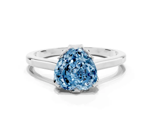 Fancy Blue Heart Cut Diamond Solitaire Ring with Flower Prong Setting and Classic Band Platinum