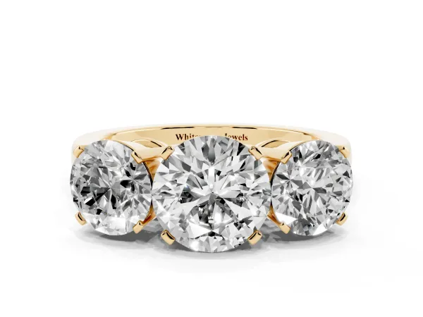 Three-Stone Round Cut Cut Diamond Ring with Channel Set Band and Four-Prong Setting Yellow gold