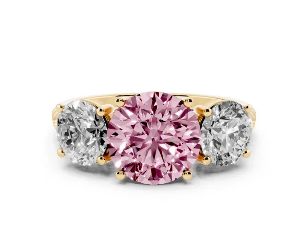 Fancy Pink Three-Stone Round Cut Diamond Ring with Round Pavé Band and Prong Setting Yellow gold