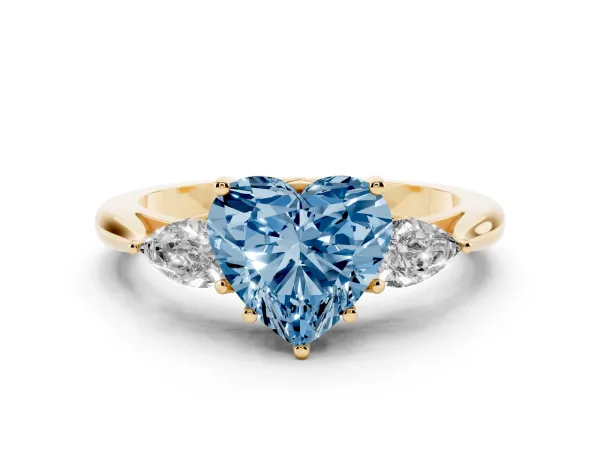Fancy Blue Three-Stone Heart Cut Brilliant Diamond Solitaire Ring with Tapered Band and Four-Prong Setting Yellow gold