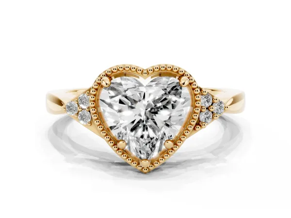 Milgrain Heart Cut Cut Diamond Ring with Tapered Pave Band and Four Prong Setting Yellow gold