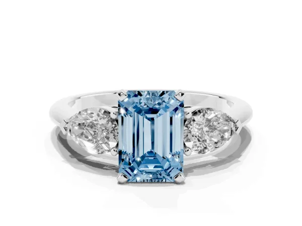 Fancy Blue Three-Stone Emerald Cut Diamond Ring with Pear Side Stones and Four-Prong Setting Platinum