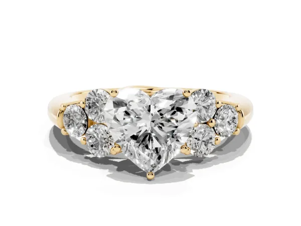 Heart Cut Cut Diamond Cluster Ring with Round Accent Stones and Prong Setting on a Classic Band Yellow gold